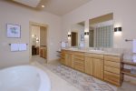 Main-level master ensuite- Walk-in shower- Jetted tub- Dual vanity